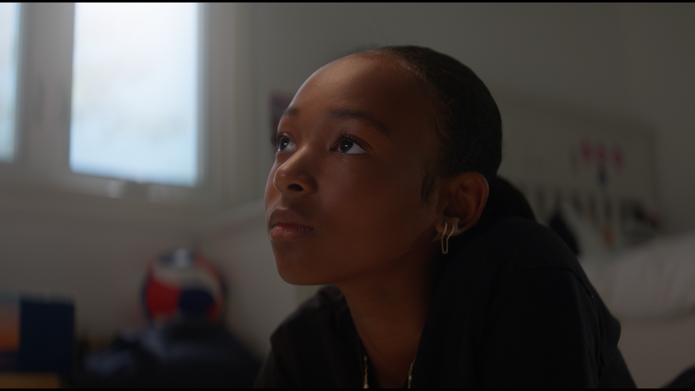 Close-up of Zhuri James looking upward